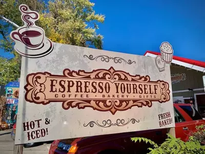 Espresso Yourself sign in front of coffee shop