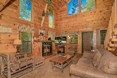 living room with fireplace inside Black Bear Creek Cabin