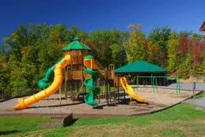 yellow and green playground with slide